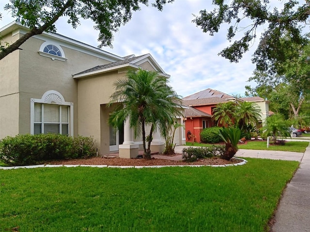 10415 Lucaya Dr, Tampa, FL 33647 - mediterranean / spanish house featuring stucco siding and a front lawn