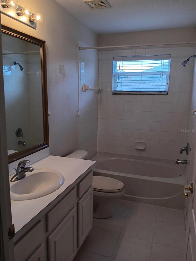 10415 Lucaya Dr, Tampa, FL 33647 - bathroom with tile patterned flooring, bathing tub / shower combination, vanity, and toilet