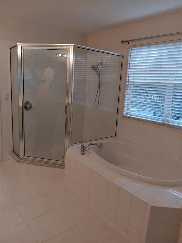 10415 Lucaya Dr, Tampa, FL 33647 - full bathroom featuring a garden tub, a shower stall, and tile patterned flooring