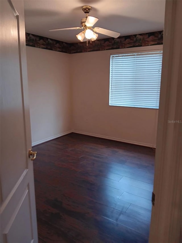 10415 Lucaya Dr, Tampa, FL 33647 - spare room with ceiling fan, dark wood-type flooring, and baseboards