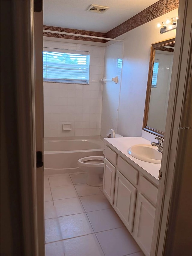 10415 Lucaya Dr, Tampa, FL 33647 - bathroom featuring tile patterned flooring, vanity, toilet, and shower / bath combination