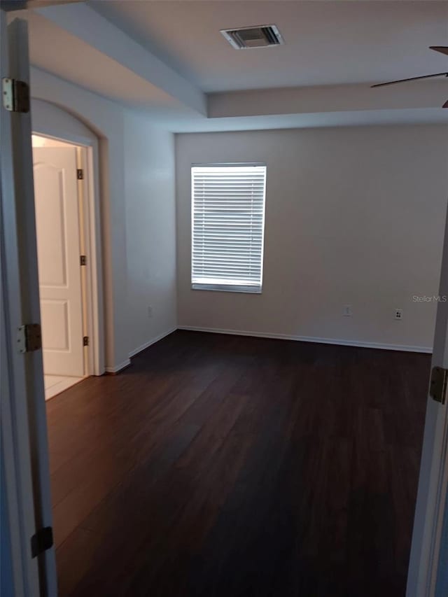 10415 Lucaya Dr, Tampa, FL 33647 - empty room with dark wood-type flooring, baseboards, and ceiling fan