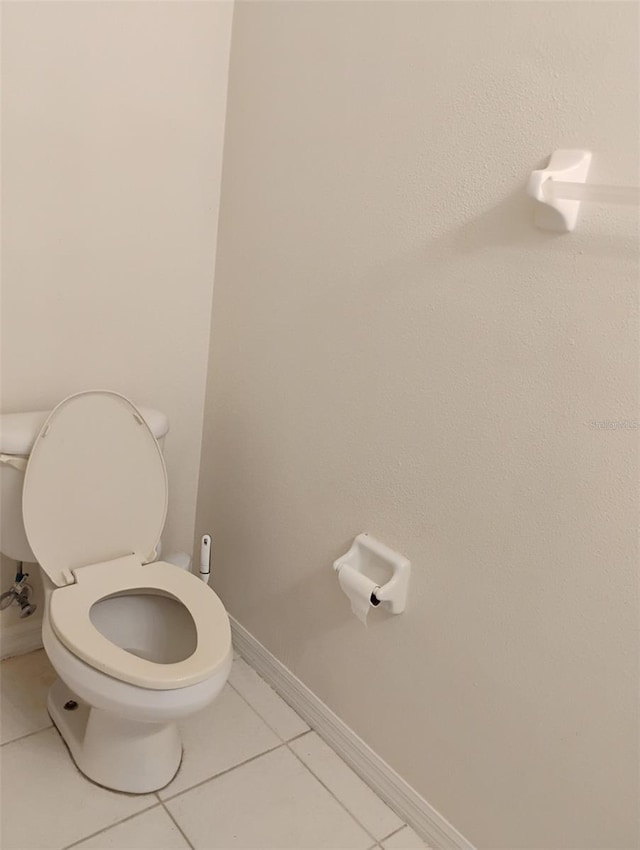 10415 Lucaya Dr, Tampa, FL 33647 - bathroom featuring toilet, tile patterned floors, and baseboards