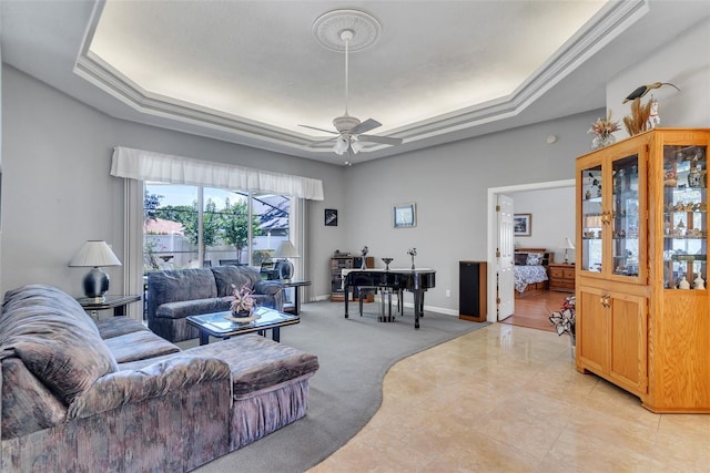 34239 Woodridge Ln, Eustis, FL 32736 - living room with a tray ceiling, ceiling fan, and baseboards