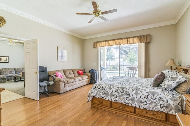 34239 Woodridge Ln, Eustis, FL 32736 - bedroom with access to outside, ornamental molding, wood finished floors, and ceiling fan
