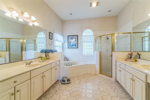 34239 Woodridge Ln, Eustis, FL 32736 - bathroom featuring two vanities, a stall shower, a garden tub, and tile patterned flooring