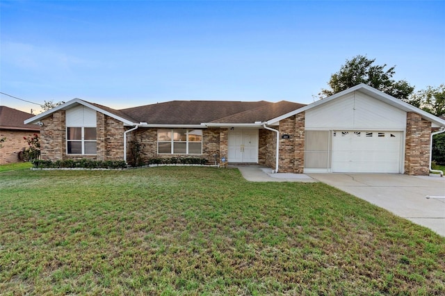 2018 N Normandy Blvd, Deltona, FL 32725 - mid-century modern home featuring an attached garage, concrete driveway, a front lawn, and brick siding