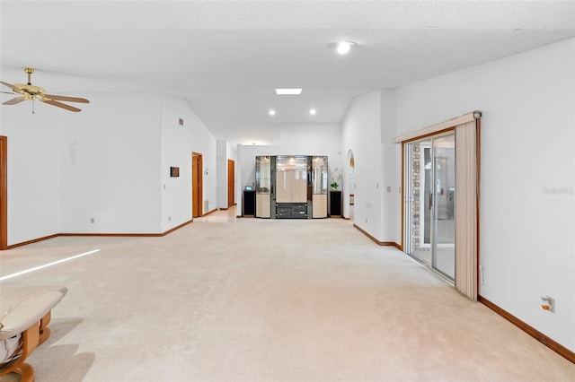 2018 N Normandy Blvd, Deltona, FL 32725 - unfurnished living room with light colored carpet, baseboards, and recessed lighting