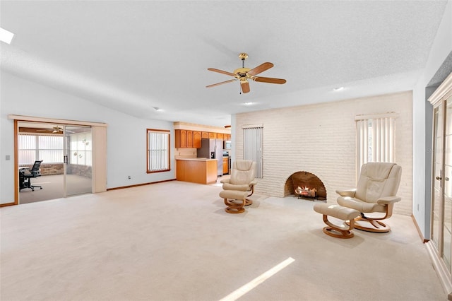 2018 N Normandy Blvd, Deltona, FL 32725 - living area featuring a brick fireplace, light colored carpet, ceiling fan, and baseboards