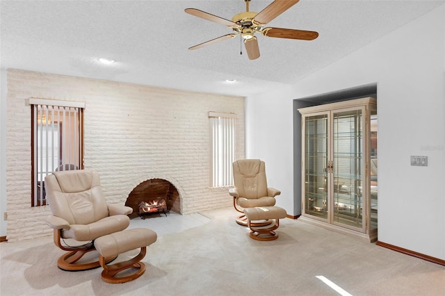 2018 N Normandy Blvd, Deltona, FL 32725 - sitting room with healthy amount of natural light, carpet floors, ceiling fan, a textured ceiling, and a brick fireplace