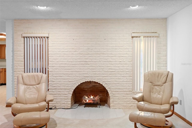 2018 N Normandy Blvd, Deltona, FL 32725 - sitting room featuring a textured ceiling, a brick fireplace, and tile patterned flooring