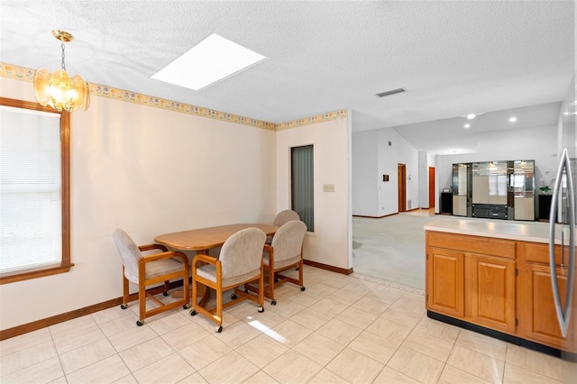 2018 N Normandy Blvd, Deltona, FL 32725 - dining area with a skylight, baseboards, a textured ceiling, and a chandelier