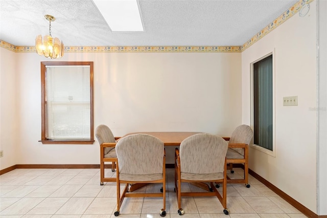 2018 N Normandy Blvd, Deltona, FL 32725 - dining area with a chandelier, a textured ceiling, and baseboards