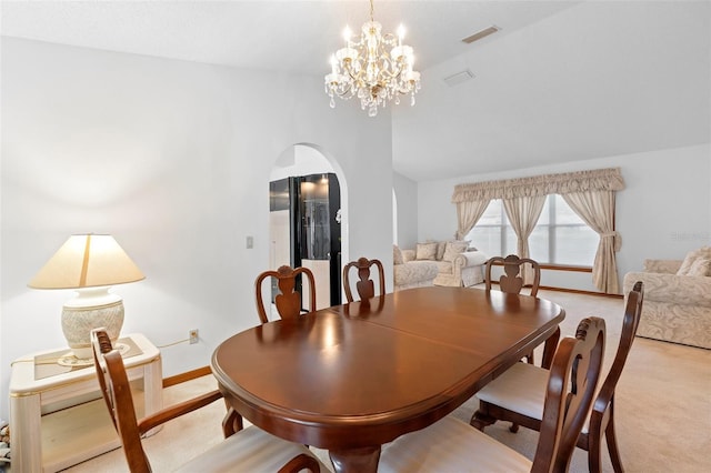 2018 N Normandy Blvd, Deltona, FL 32725 - dining room with arched walkways, light colored carpet, baseboards, lofted ceiling, and a chandelier