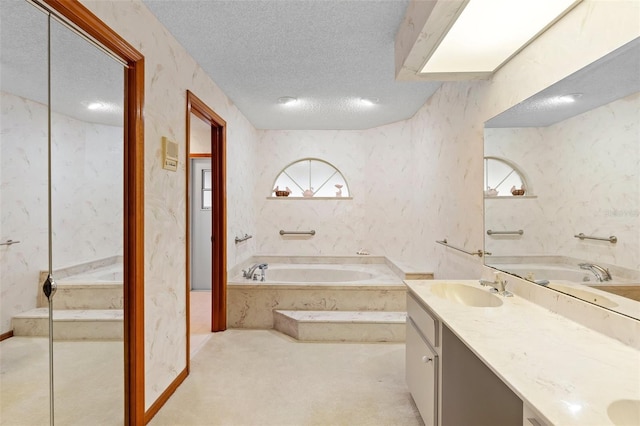 2018 N Normandy Blvd, Deltona, FL 32725 - bathroom with a garden tub, a textured ceiling, and double vanity