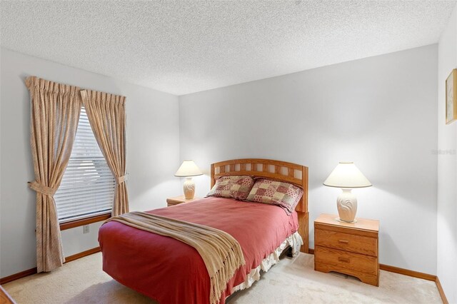 2018 N Normandy Blvd, Deltona, FL 32725 - bedroom featuring carpet flooring, a textured ceiling, and baseboards