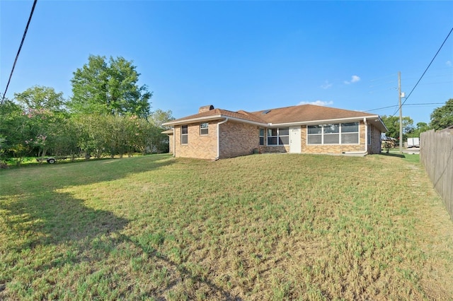 2018 N Normandy Blvd, Deltona, FL 32725 - back of property featuring a chimney and brick siding