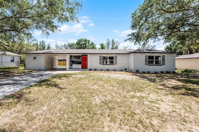 410 W Seminole Ave, Eustis, FL 32726 - view of front of house featuring concrete driveway and a carport