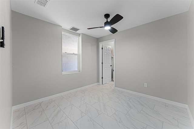 410 W Seminole Ave, Eustis, FL 32726 - empty room with ceiling fan, light marble finish floors, and baseboards