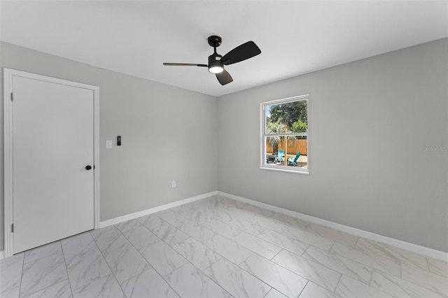 410 W Seminole Ave, Eustis, FL 32726 - empty room with light marble finish flooring, a ceiling fan, and baseboards