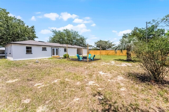 410 W Seminole Ave, Eustis, FL 32726 - back of property featuring french doors and a patio area