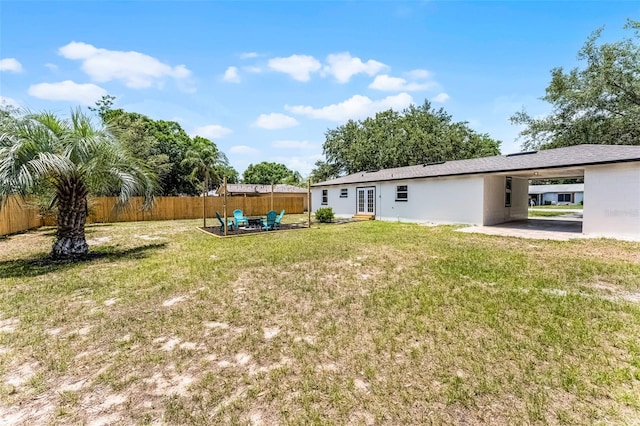 410 W Seminole Ave, Eustis, FL 32726 - back of house with french doors and a carport