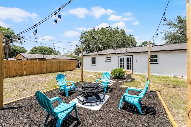 410 W Seminole Ave, Eustis, FL 32726 - back of property featuring french doors and an outdoor fire pit