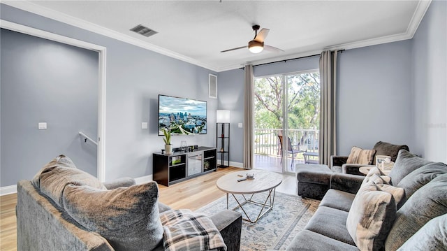 5016 W Lancaster St Unit 00, Tampa, FL 33616 - living room with light wood-style flooring, a ceiling fan, crown molding, and baseboards