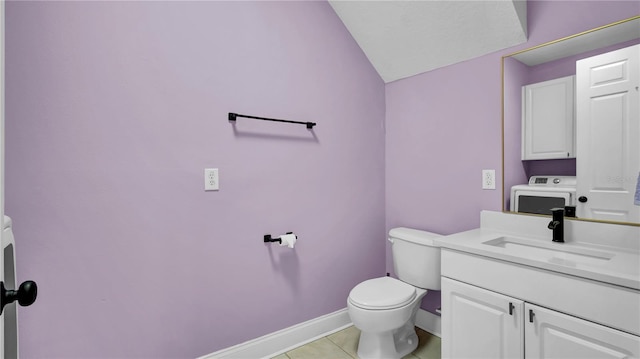 5016 W Lancaster St Unit 00, Tampa, FL 33616 - half bath with washer / clothes dryer, toilet, vanity, tile patterned floors, and vaulted ceiling