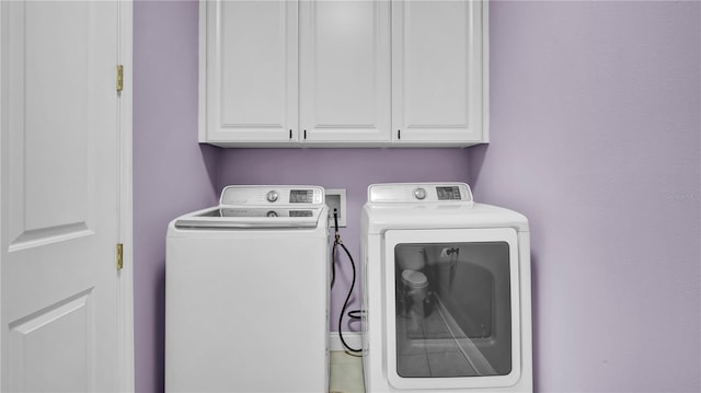 5016 W Lancaster St Unit 00, Tampa, FL 33616 - laundry area with cabinet space and independent washer and dryer