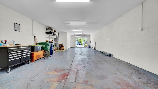 5016 W Lancaster St Unit 00, Tampa, FL 33616 - garage with concrete block wall and a workshop area