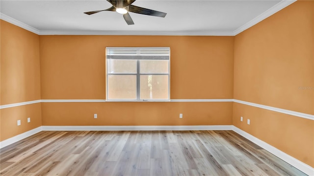 5016 W Lancaster St Unit 00, Tampa, FL 33616 - empty room featuring wood finished floors, baseboards, ornamental molding, and ceiling fan