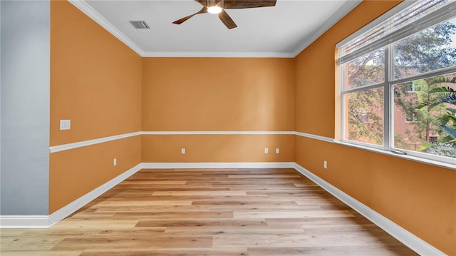5016 W Lancaster St Unit 00, Tampa, FL 33616 - empty room with ceiling fan, ornamental molding, baseboards, and light wood-type flooring