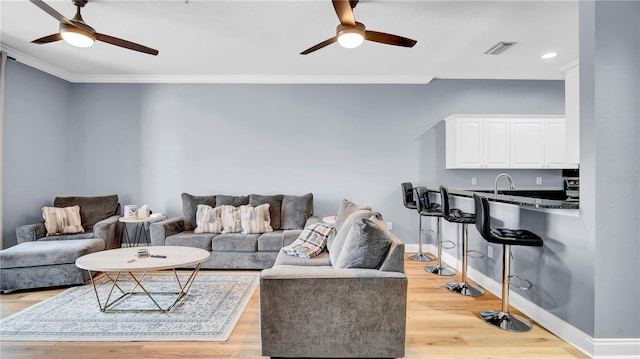 5016 W Lancaster St Unit 00, Tampa, FL 33616 - living area with ceiling fan, ornamental molding, light wood-style flooring, baseboards, and recessed lighting