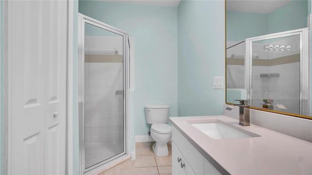 5016 W Lancaster St Unit 00, Tampa, FL 33616 - bathroom with vanity, a shower stall, tile patterned floors, and toilet