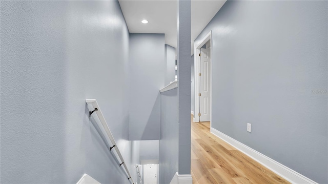 5016 W Lancaster St Unit 00, Tampa, FL 33616 - hall featuring an upstairs landing, light wood-style floors, baseboards, and recessed lighting