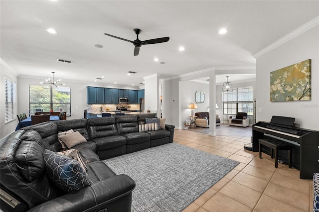 1716 Wild Indigo Ter, Oviedo, FL 32766 - living area with a chandelier, ornamental molding, a ceiling fan, light tile patterned floors, and plenty of natural light