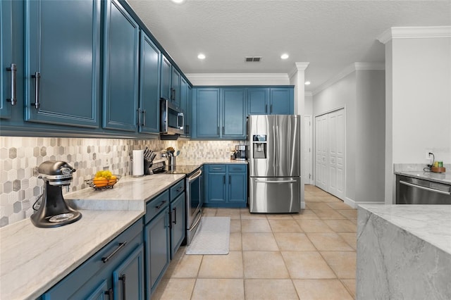 1716 Wild Indigo Ter, Oviedo, FL 32766 - kitchen featuring stainless steel appliances, blue cabinetry, crown molding, light stone countertops, and light tile patterned floors