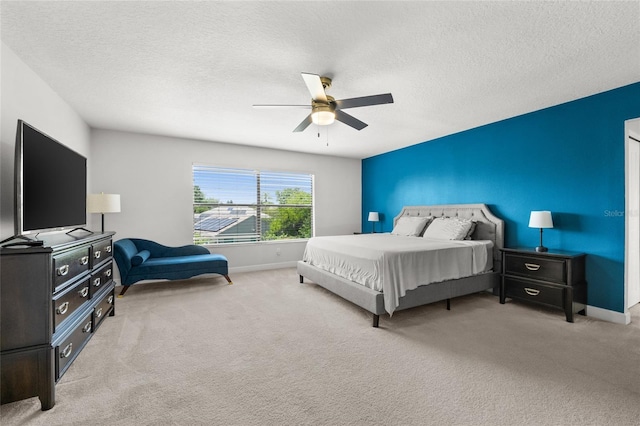 1716 Wild Indigo Ter, Oviedo, FL 32766 - carpeted bedroom with baseboards, a textured ceiling, and ceiling fan