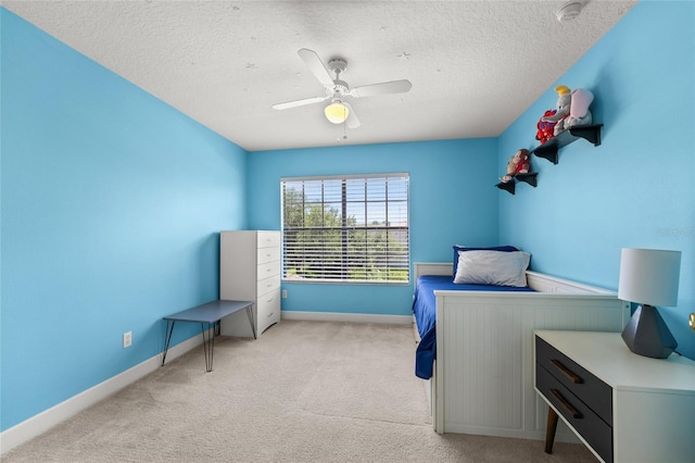 1716 Wild Indigo Ter, Oviedo, FL 32766 - bedroom with baseboards, carpet floors, a textured ceiling, and a ceiling fan