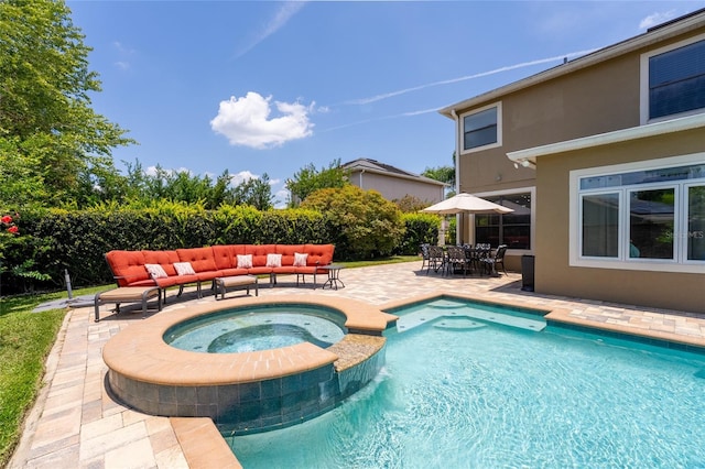 1716 Wild Indigo Ter, Oviedo, FL 32766 - view of swimming pool with outdoor lounge area, a patio area, outdoor dining space, and a pool with connected hot tub
