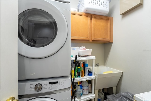 1716 Wild Indigo Ter, Oviedo, FL 32766 - washroom with stacked washer / dryer and cabinet space