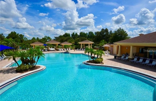 1716 Wild Indigo Ter, Oviedo, FL 32766 - community pool featuring a gazebo and a patio