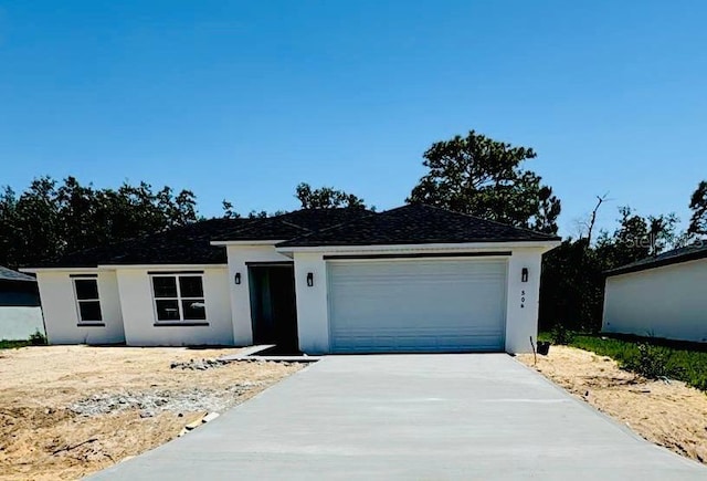 509 St Johns Ct, Poinciana, FL 34759 - ranch-style home with concrete driveway, stucco siding, and a garage