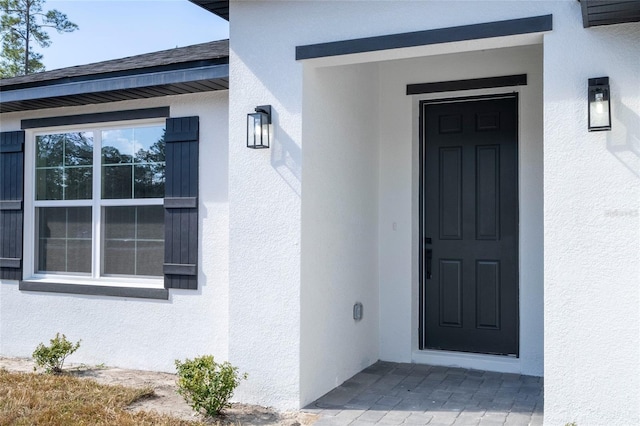 509 St Johns Ct, Poinciana, FL 34759 - entrance to property featuring stucco siding