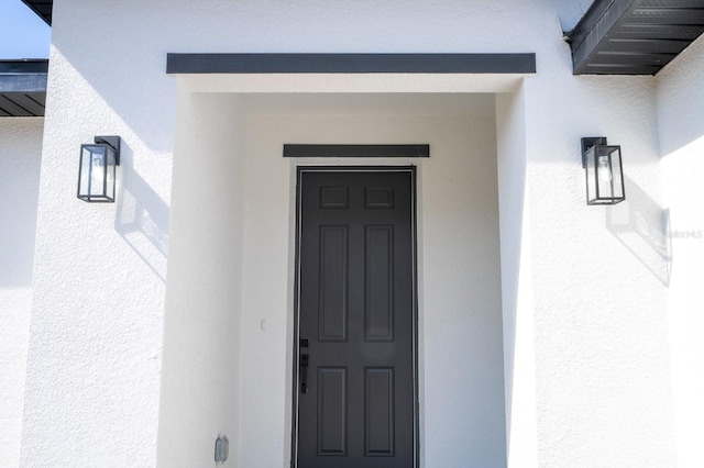 509 St Johns Ct, Poinciana, FL 34759 - view of exterior entry with stucco siding