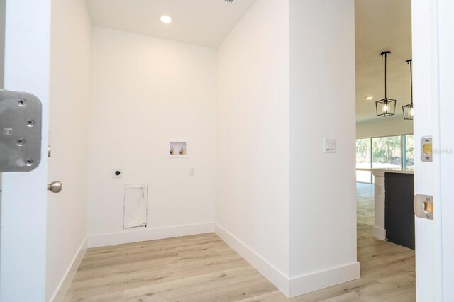 509 St Johns Ct, Poinciana, FL 34759 - laundry area featuring washer hookup, light wood-style floors, baseboards, recessed lighting, and hookup for an electric dryer