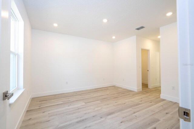 509 St Johns Ct, Poinciana, FL 34759 - empty room with recessed lighting, light wood-type flooring, and baseboards