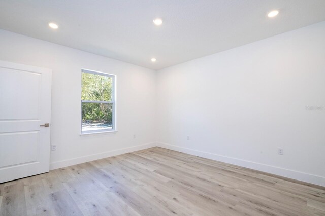 509 St Johns Ct, Poinciana, FL 34759 - unfurnished room with light wood-style floors, recessed lighting, and baseboards