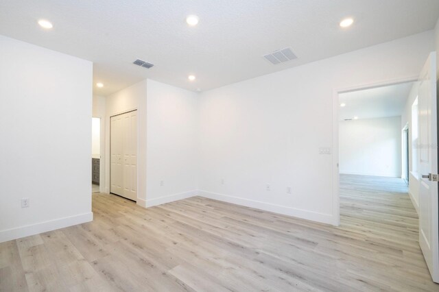 509 St Johns Ct, Poinciana, FL 34759 - unfurnished room featuring light wood-style flooring, recessed lighting, and baseboards